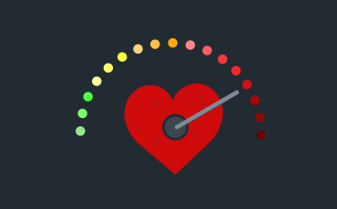 Red heart with dial pointing towards the red part of a scale of dots